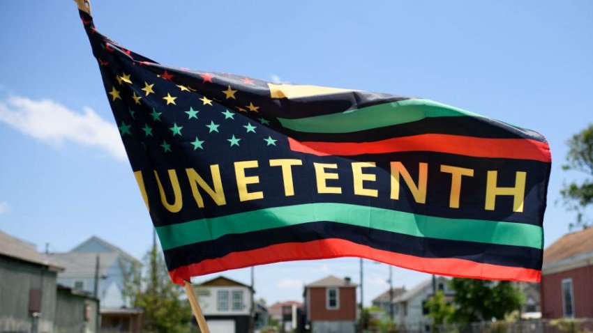 A Juneteenth flag flies on a float during the 45th annual Juneteenth National Independence Day celebrations in Galveston, Texas, on June 15, 2024. Juneteenth falls on June 19 and has often been celebrated on the third Saturday in June, to mark the end of slavery in the US. (Photo by Mark Felix / AFP) (Photo by MARK FELIX/AFP via Getty Images)